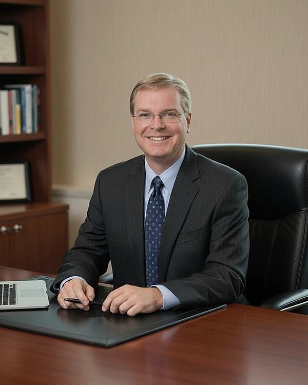 Tim Adams at his desk in the Braeside office